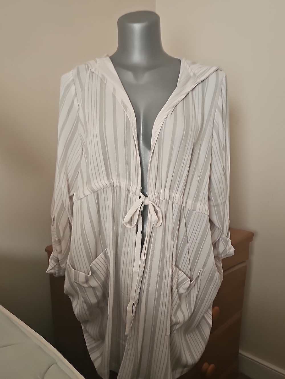 Torrid Black Logo Tag on Cream Fabric
